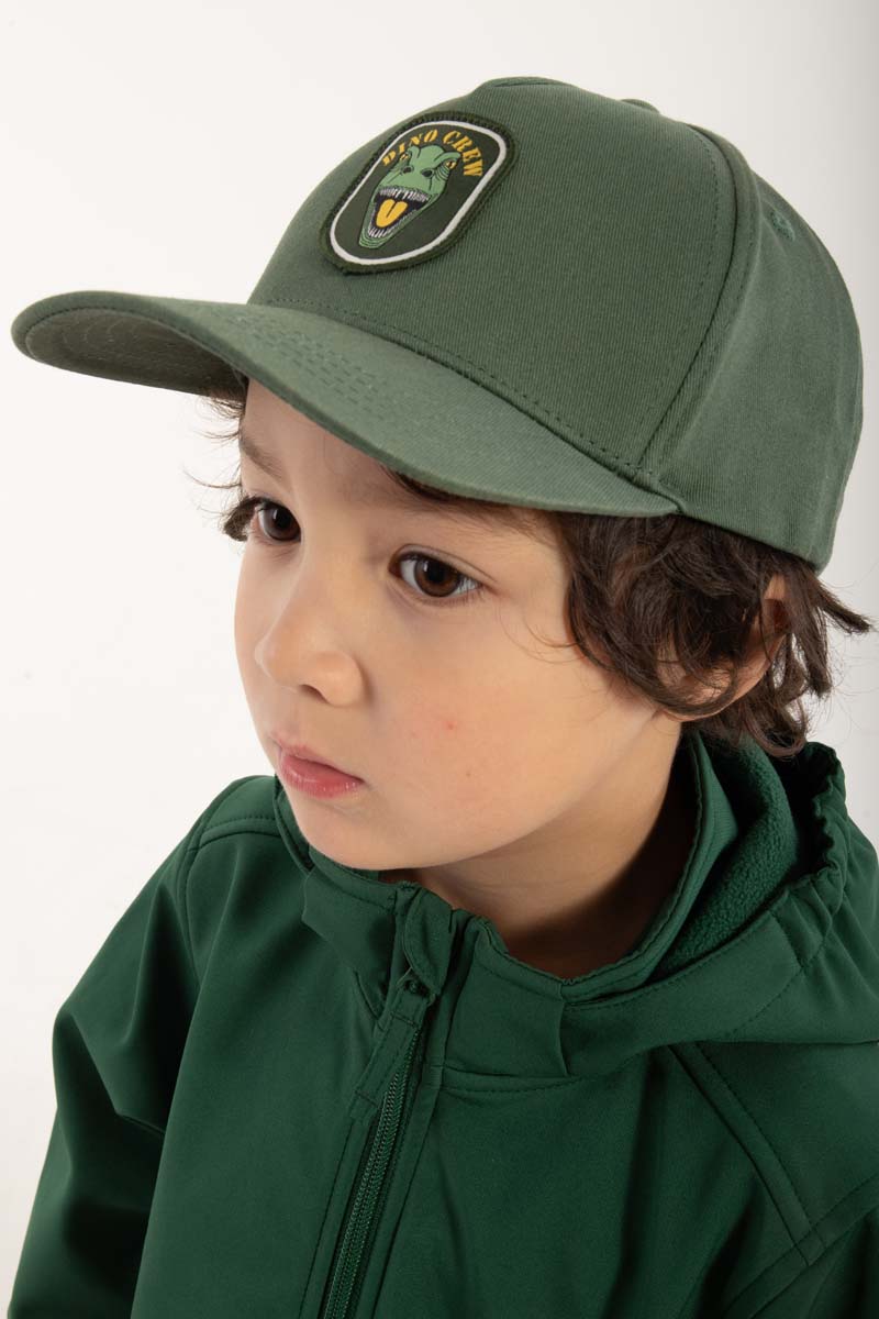 Fin grøn kasket til børn med print af dinosaur