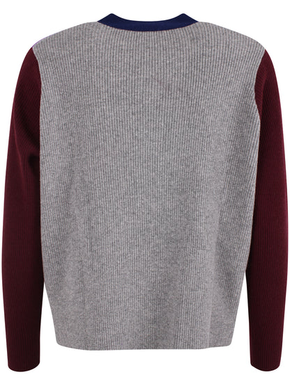 Dejlig sweater med v-hals i 100% merinould og lilla nuancer til kvinder