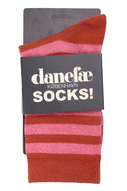 Stribede sokker med glittereffekt i lyserød og brændt rød til kvinder